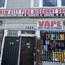 New City Plus Smoke Vape Shop - Front of shop with handwritten sign