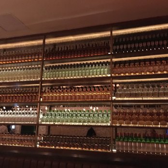 Maison Pickle - Wall of liquor - Cocktail Bars Near Me - New York, New York