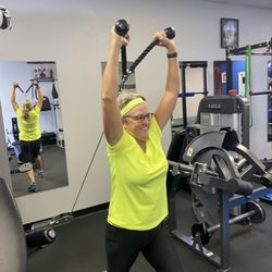 Client performing Overhead Tricep Extensions