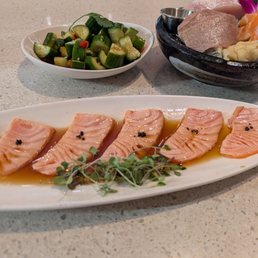 Cucumber salad, sashimi sampler and salmon carpaccio (clockwise from the top) Cucumber salad, sashimi sampler and salmon carpaccio (clockwise from the top)