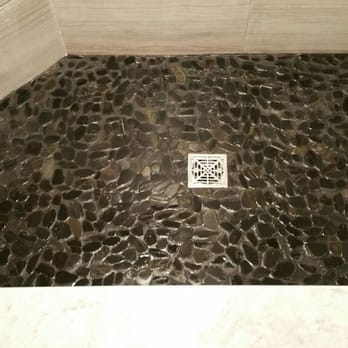 All Pro Renovations - a shower with a stone floor - General Contractors Near Me All Pro Renovations - a shower with a stone floor - General Contractors Near Me