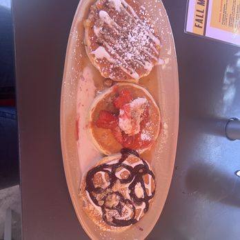 Snooze, an A.M. Eatery - Pancake flight (apple crisp (pancake of the week), strawberry shortcake, blueberry danish) - Breakfast & Brunch Near Me - Tustin, California Snooze, an A.M. Eatery - Pancake flight (apple crisp (pancake of the week), strawberry shortcake, blueberry danish) - Breakfast & Brunch Near Me - Tustin, California