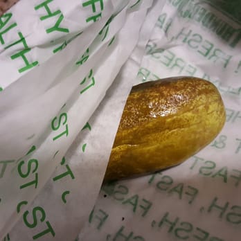 Thundercloud Subs - Pickle, wrapped in four pieces of paper - Sandwiches Near Me - Austin, Texas