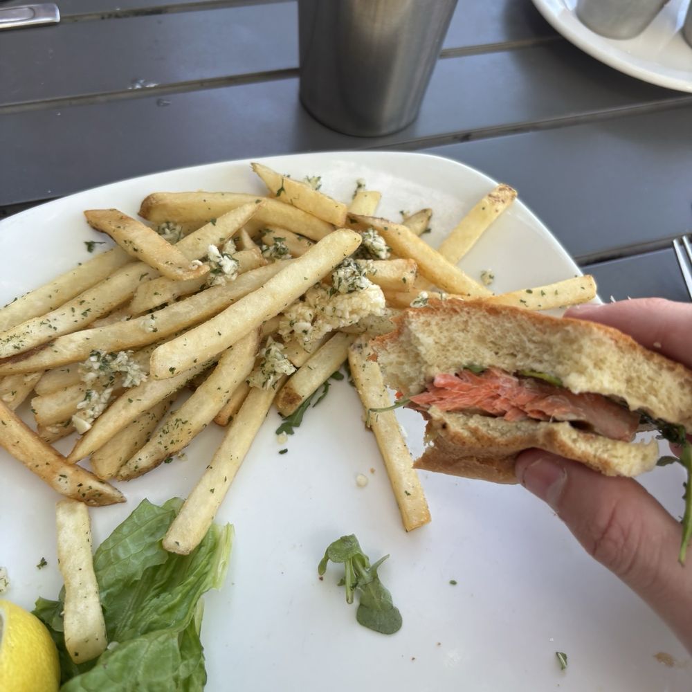 Salmon sandwich with garlic fries