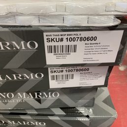 Defective tile manufacturer. Fake mother of pearl bonded to plastic that pops off because it is glued on top of the marble.