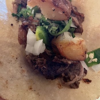 On The Grill - Made taco from Barbacoa Botan dish - Tex-Mex Near Me - Edinburg, Texas On The Grill - Made taco from Barbacoa Botan dish - Tex-Mex Near Me - Edinburg, Texas