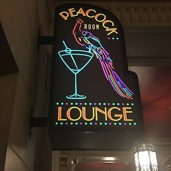 Peacock Room Lounge - The sign for the Peacock Room inside the hotel it is connected to, at the side of the huge other restaurant in the building. - Jazz & Blues Near Me - Spokane, Washington