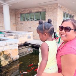 Baby Kori and my best friend out front! We are looking at the Koi fish :-) Baby Kori and my best friend out front! We are looking at the Koi fish :-)