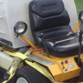 Norton Landscaping - the back of a yellow tractor - Landscaping Near Me