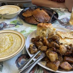 Eggs, potatoes, grits, biscuit