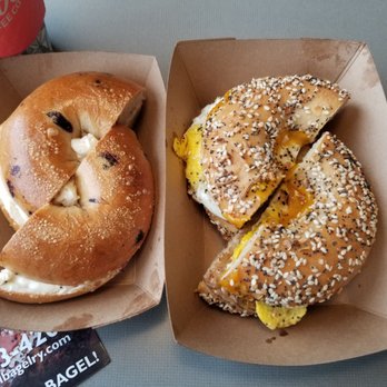 St Paul Bagelry - Eggs, Sausage and Cheese on an Everything Bagel (R); Caramel Apple Cream Cheese on a Blueberry Bagel (L) - Bagels Near Me - Minneapolis, Minnesota