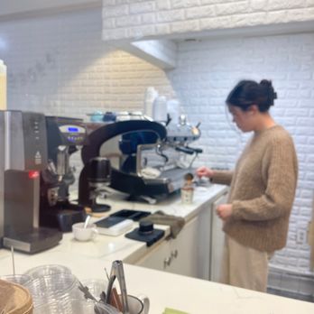 Flat White Coffee - Meticulous barista crafting an iced almond milk latte - Cafes Near Me - Cypress, California Flat White Coffee - Meticulous barista crafting an iced almond milk latte - Cafes Near Me - Cypress, California