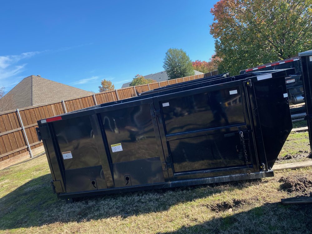 Slide of Ortiz roofing & dumpsters