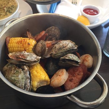 Pilot House - Steam pot with clams, mussels, oysters, crab legs,shrimp, corn on the cob and andouille sausage. Absolutely delicious - Seafood Near Me - Wilmington, North Carolina Pilot House - Steam pot with clams, mussels, oysters, crab legs,shrimp, corn on the cob and andouille sausage. Absolutely delicious - Seafood Near Me - Wilmington, North Carolina