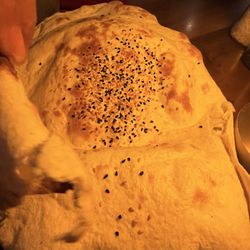 The Khorasani - The bread that they bring to the table is the best part. It's all delicate and puffy and then magically deflates as it cools.