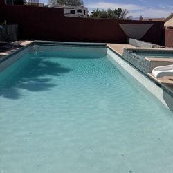 Blue Desert Pools - Pool & spa Remodel, New tile installation, Blue/Teal Quartz finish, last pic while filling up...*Texture deck was still not finished.