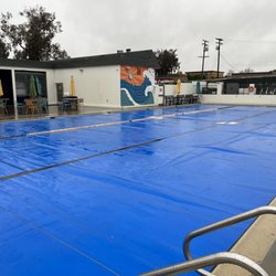 RSL Aquatics - Tarps over the pool so it says warm for early morning lap swim
