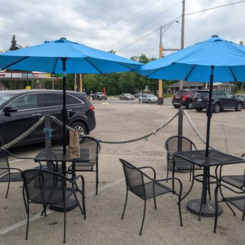 Macs Fish & Chips - tables and chairs with blue umbrellas - British Near Me - Saint Paul, Minnesota Macs Fish & Chips - tables and chairs with blue umbrellas - British Near Me - Saint Paul, Minnesota