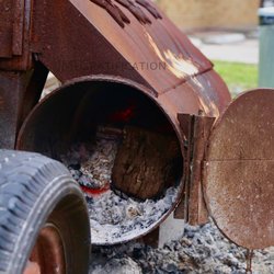 T-Ghost BBQ - Mesquite in the firebox for that smoke taste.