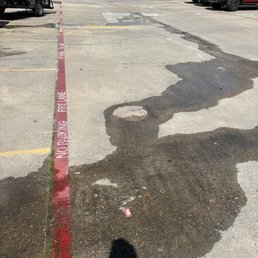 Sewage draining from the back of the restaurant into parking lot drain. Smells like !  Disgusting