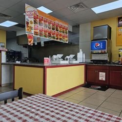 Mom's Burgers & Wings - Loud overhead grill vent and very loud ice machine above the soda machine.