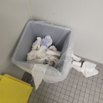 CVS Pharmacy - a trash can filled with toilet paper - Drugstores Near Me - Pembroke Pines, Florida