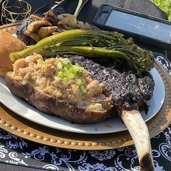 Phiesty Foods Catering - Tomahawk steak with seafood stuffed twice baked potatoes broccolini and dinner roll - Personal Chefs Near Me - Oakland, California Phiesty Foods Catering - Tomahawk steak with seafood stuffed twice baked potatoes broccolini and dinner roll - Personal Chefs Near Me - Oakland, California