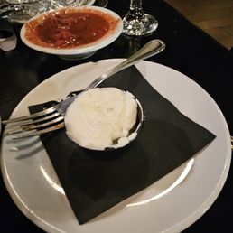 a plate of food and a glass of wine a plate of food and a glass of wine