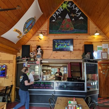 Panorama Pizza Pub - a woman walking in front of the counter - Pizza Near Me - Healy, Alaska