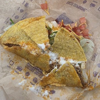 Taco Bell - Looks like someone punched this taco before putting it in the bag. Never eating there again. - Fast Food Near Me - Gun Barrel City, Texas