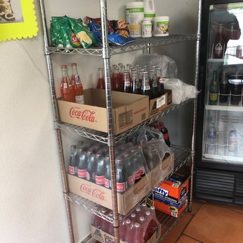 Jalapeno Express - a shelf of sodas, sodas, and other beverages - Mexican Near Me - Temple, Texas
