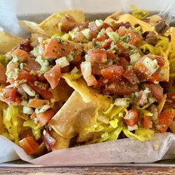 Off The Wall Tap House - Smoked Brisket Nachos (Appetizers section). THE BEST NACHOS EVER, HANDS DOWN. The chopped pepperoncini truly makes this dish.