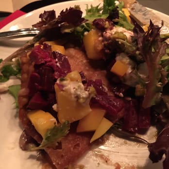 Cork & Fork - This is the broken down luau salad. Fried wonton in here. This is a must. - New American Near Me - Indio, California