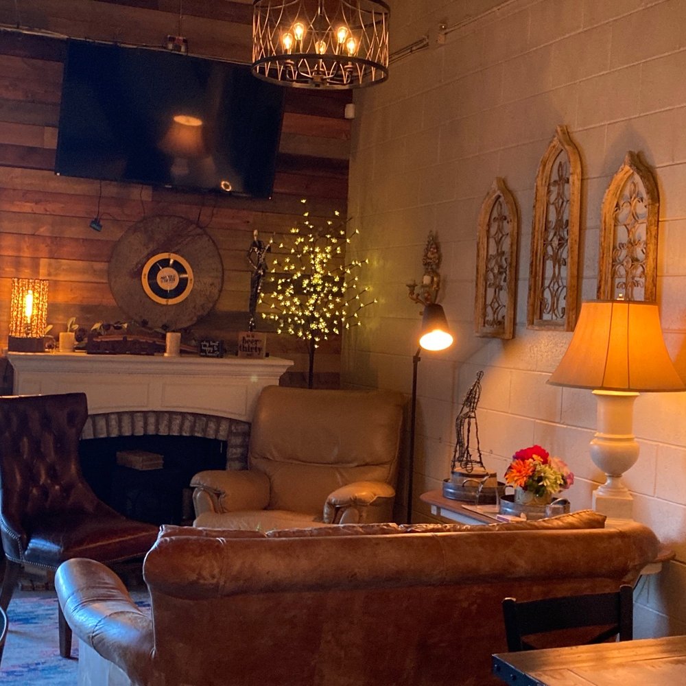 Mother Tucker Brewery - a living room with a fireplace - Breweries Near Me - Thornton, Colorado Mother Tucker Brewery - a living room with a fireplace - Breweries Near Me - Thornton, Colorado