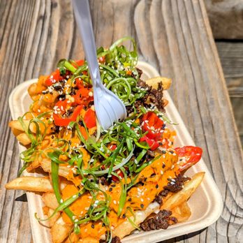 Monkish Brewing - a plate of fries with a fork - Breweries Near Me - Torrance, California