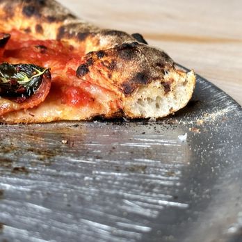 Anello - a slice of pizza on a plate - Pizza Near Me - Tucson, Arizona