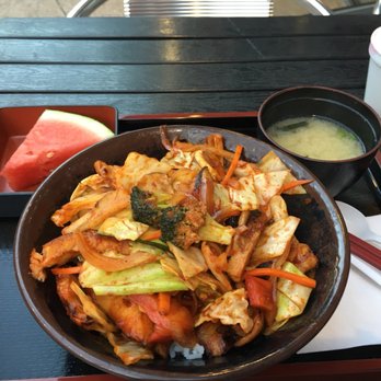 Donburi Cafè - Spicy chicken bowl. The miso and watermelon are included at no extra charge. - Japanese Near Me - Long Beach, California