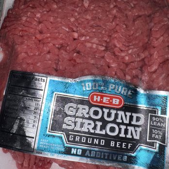 H-E-B - It appeared fine from the outside - The image shows a tray of ground sirloin beef from H-E-B, packaged in a foam tray with a blue and black label. The label states it is 100% pure, lean ground beef with 90% lean and 10% fat content, and emphasizes no additives. The beef appears fresh and red, and the packaging includes nutritional facts and storage instructions. - Grocery Near Me - Sugar Land, Texas