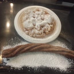 Funnel cake and a churro. Made by hand while you watch! Funnel cake and a churro. Made by hand while you watch!