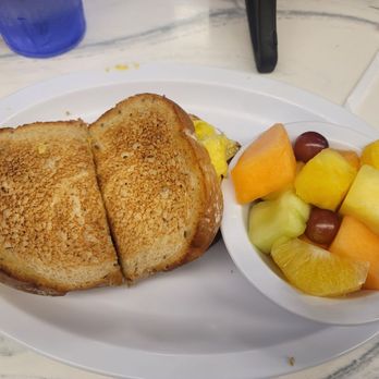 McLean's Restaurant - Breakfast sandwich (bacon) with side of fruit. I had my own tajin in my purse! - American Near Me - Richmond, Virginia McLean's Restaurant - Breakfast sandwich (bacon) with side of fruit. I had my own tajin in my purse! - American Near Me - Richmond, Virginia