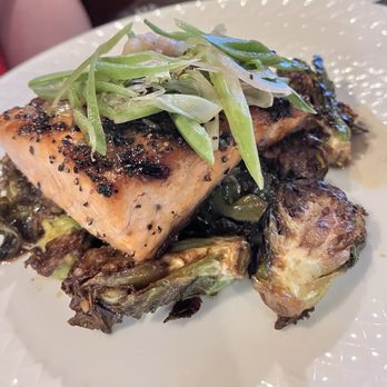 Burnt by J.H. - Salmon with a celery slaw on a bed of brussel sprouts - American Near Me - Van Alstyne, Texas