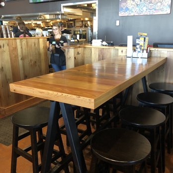Double Dogs - Gallatin - A table inside the restaurant. - Sports Bars Near Me - Gallatin, Tennessee