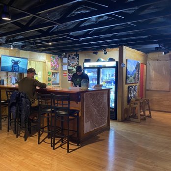 Rising Sun Pizza - Bar area and some dining tables on right side. - Pizza Near Me - St. Mary, Montana Rising Sun Pizza - Bar area and some dining tables on right side. - Pizza Near Me - St. Mary, Montana