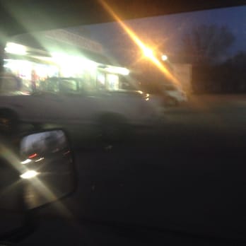 Dongar Food Mart - a blurry view of a street at night - Convenience Stores Near Me - Louisville, Kentucky