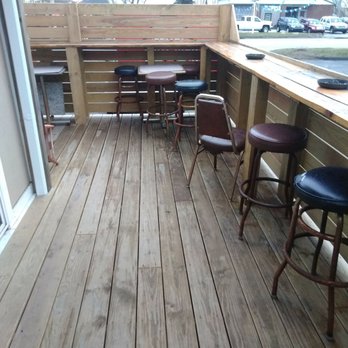 Flavors At The Split - a wooden deck with bar stools - American Near Me - Painesville, Ohio Flavors At The Split - a wooden deck with bar stools - American Near Me - Painesville, Ohio