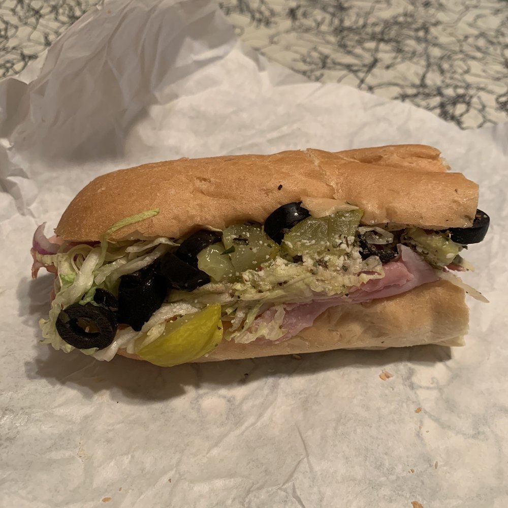The Sandwich Shoppe - What left of an Italian. I could get pics fast enough before half was devoured lol - Sandwiches Near Me - Apache Junction, Arizona