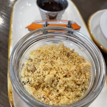 Hummus Bar & Grill - Chocolate Mousse in a Jar (top view) of cookie crumble. It is layered below with chocolate mousse and chocolate ganache - Mediterranean Near Me - Tarzana, California Hummus Bar & Grill - Chocolate Mousse in a Jar (top view) of cookie crumble. It is layered below with chocolate mousse and chocolate ganache - Mediterranean Near Me - Tarzana, California