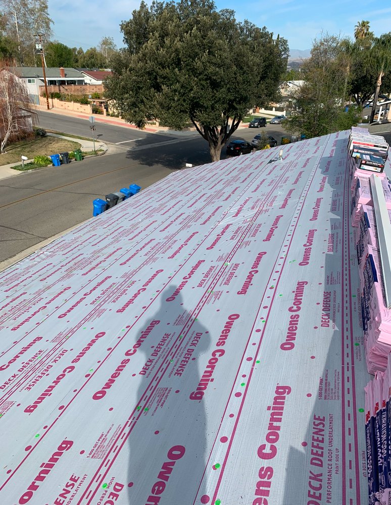 Slide of TopStamp Roofing