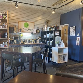Blue Wind Gourmet - a table and chairs in a coffee shop - Sandwiches Near Me - Lexington Park, Maryland