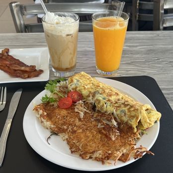 Nonna's Bistro & Cafe - Power play omelette with bacon, caramel Lyte and a large orange juice - Argentine Near Me - Pompano Beach, Florida Nonna's Bistro & Cafe - Power play omelette with bacon, caramel Lyte and a large orange juice - Argentine Near Me - Pompano Beach, Florida